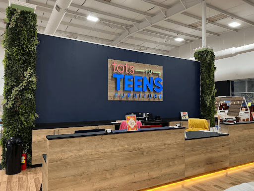 Service counter with wood finishes and integrated casework in a customer-facing space.