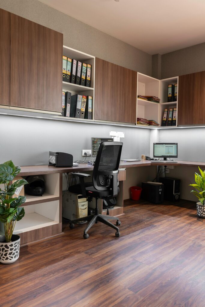 A modern office interior with brown modular wooden cabinetry and matching 